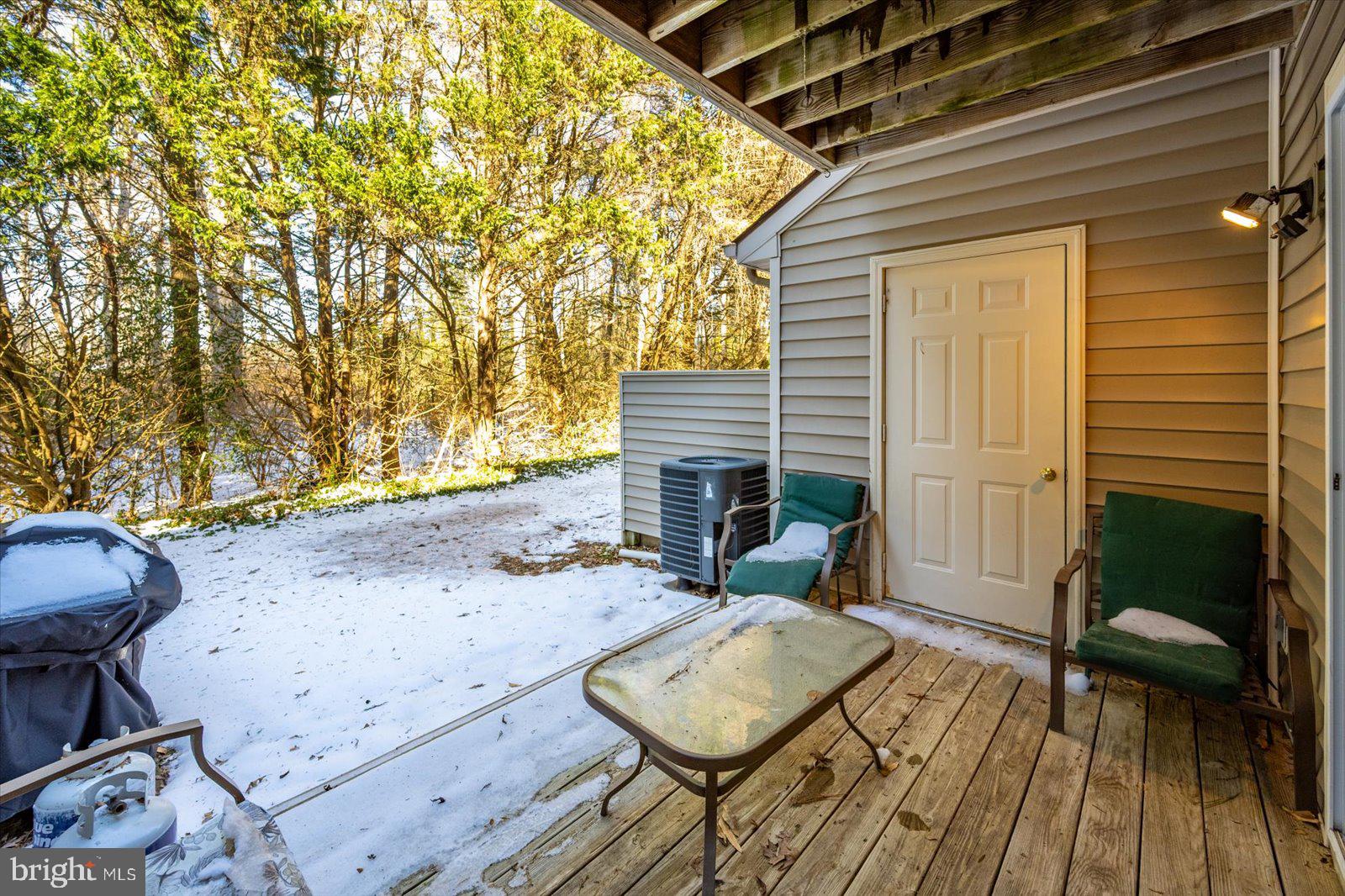 730 Canvasback Court Salisbury, MD 21804 - Photo 31 of 43 a view of a patio with table and chairs with wooden floor and fence