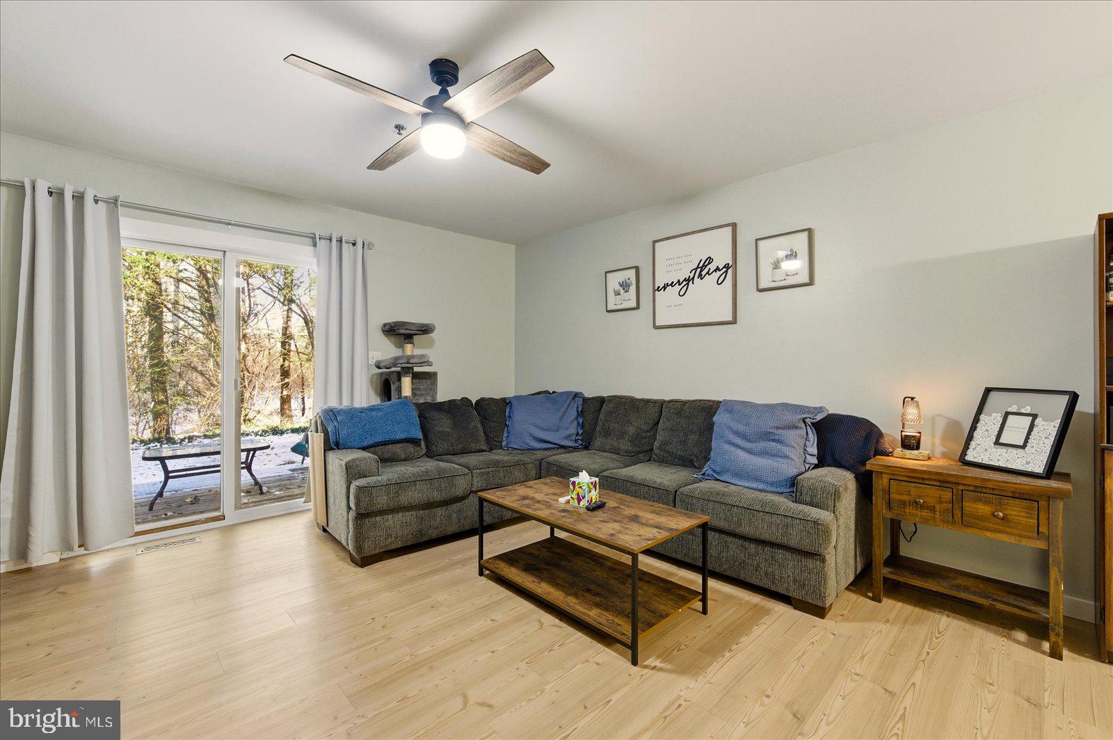 730 Canvasback Court Salisbury, MD 21804 - Photo 6 of 43 a living room with furniture and a large window with wooden floor