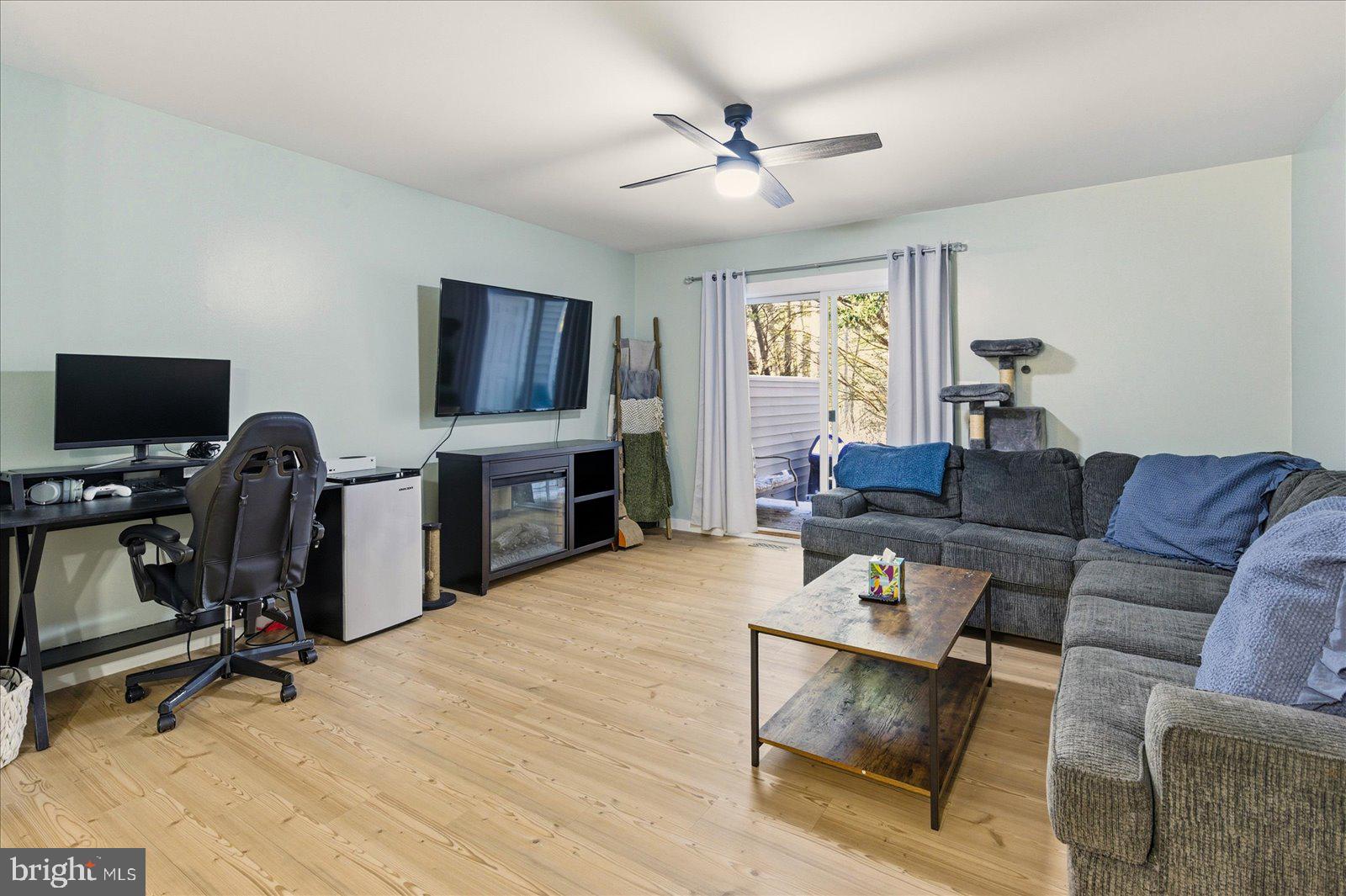 730 Canvasback Court Salisbury, MD 21804 - Photo 8 of 43 a living room with furniture and a flat screen tv