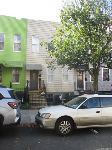 a car parked in front of a house