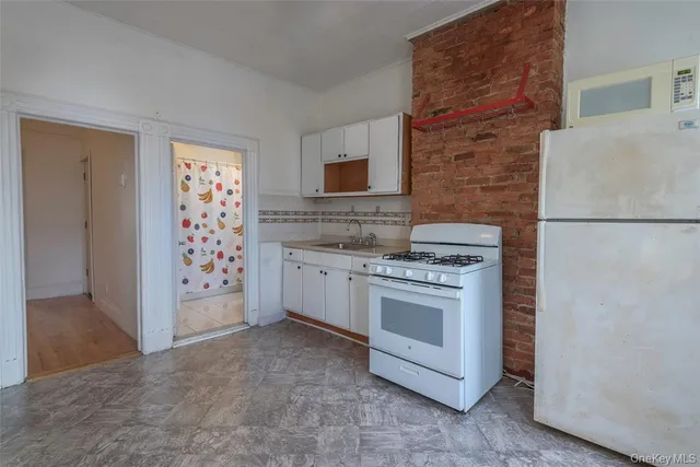 a kitchen with a stove and a refrigerator