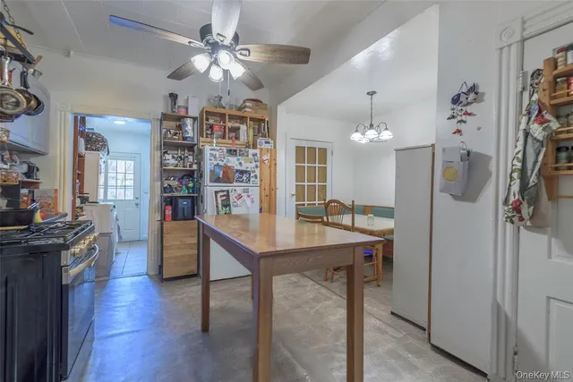 a view of a kitchen and dining room