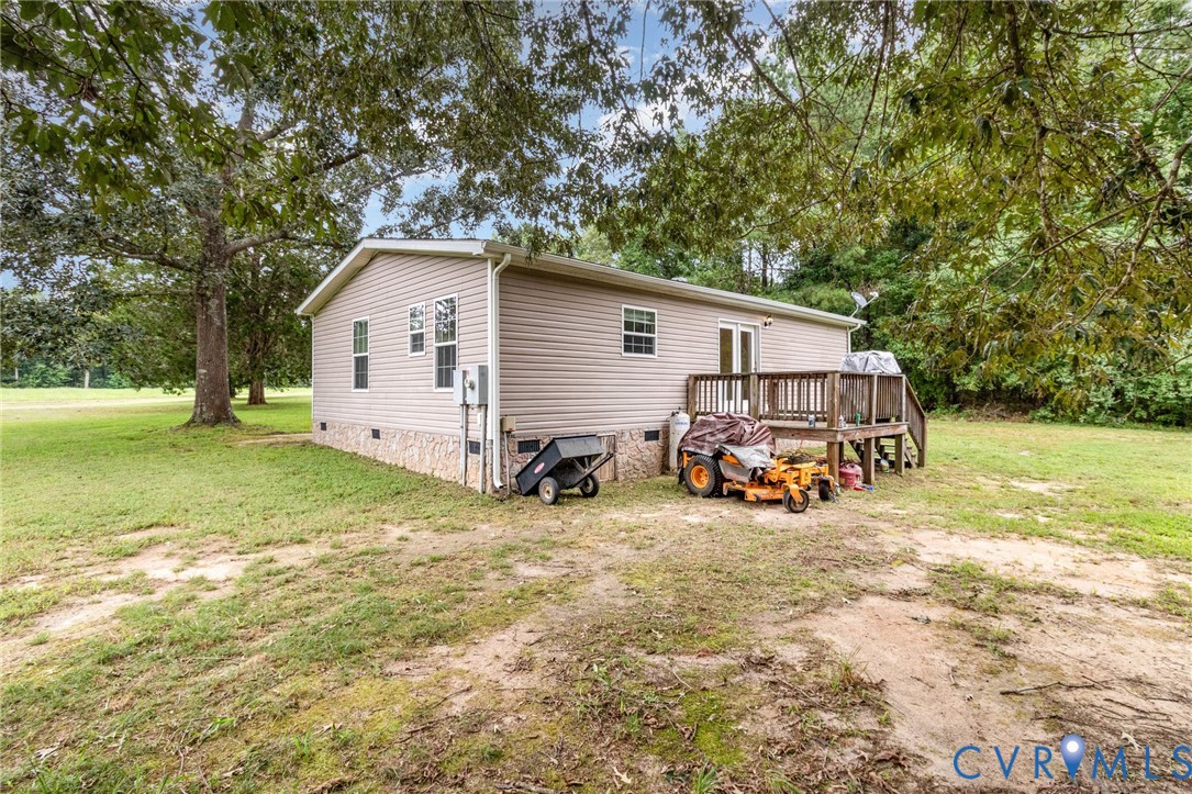 1292 Mt Prospect Road Laneview, VA 22504 - Photo 19 of 25 a view of a house with backyard and trees