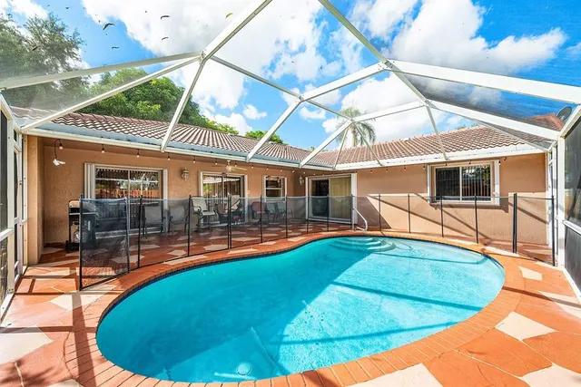 a view of a swimming pool with a patio