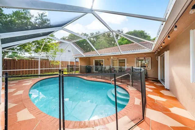a view of a swimming pool with a patio