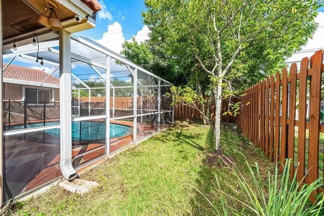 a view of a house with a backyard and stairs