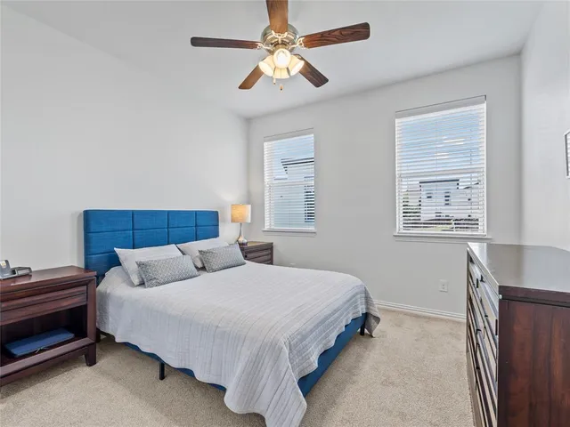 a bedroom with bed and a window