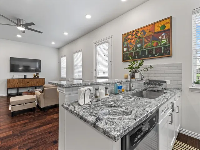 a kitchen with a stove and a sink