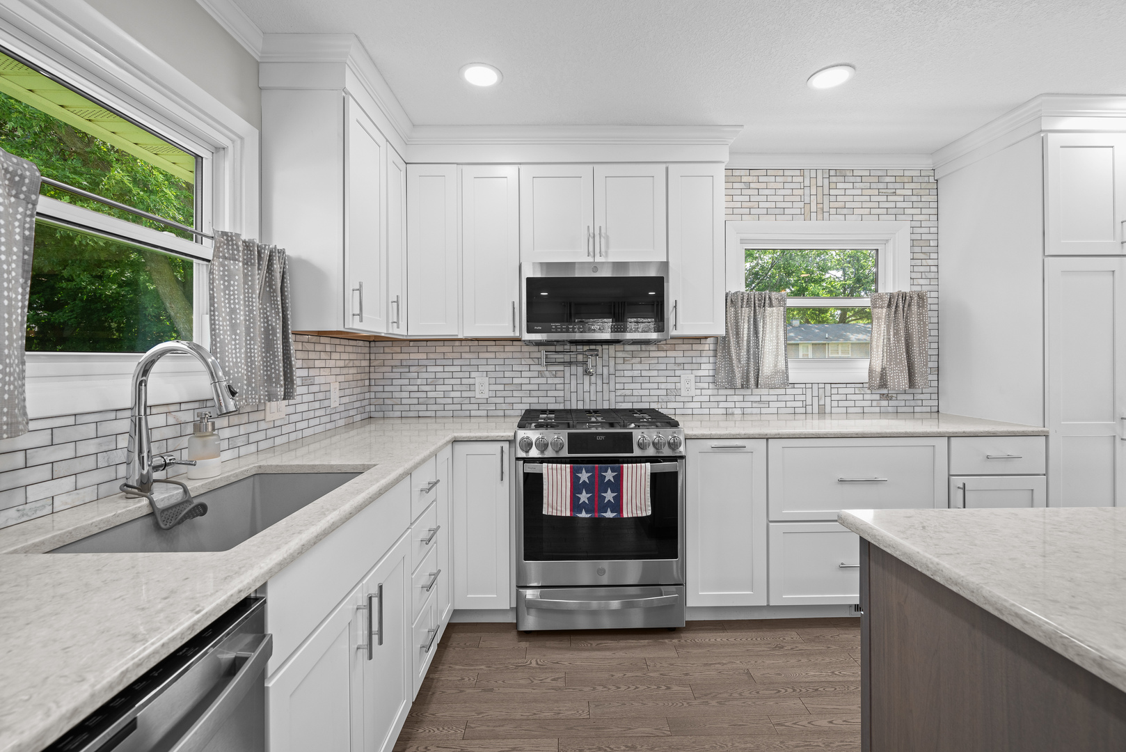 506 Bush Street Reynolds, IL 61279 - Photo 13 of 37 a kitchen with a sink stove and cabinets