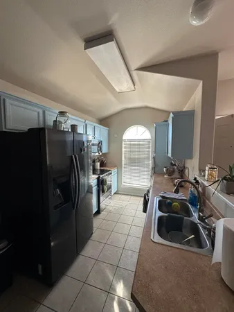 a room with gym equipment and a large window