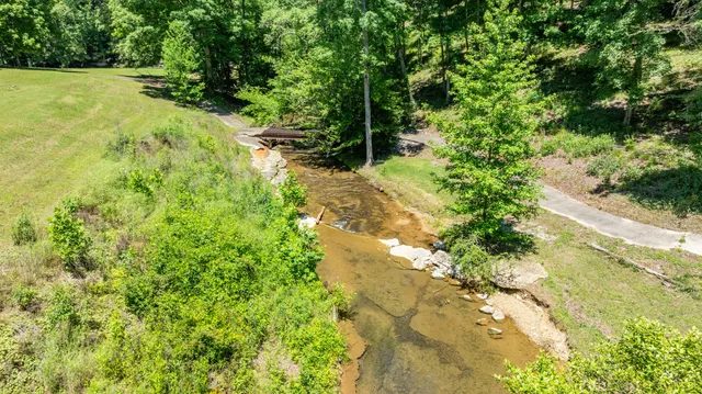 a backyard of a house with lots of green space