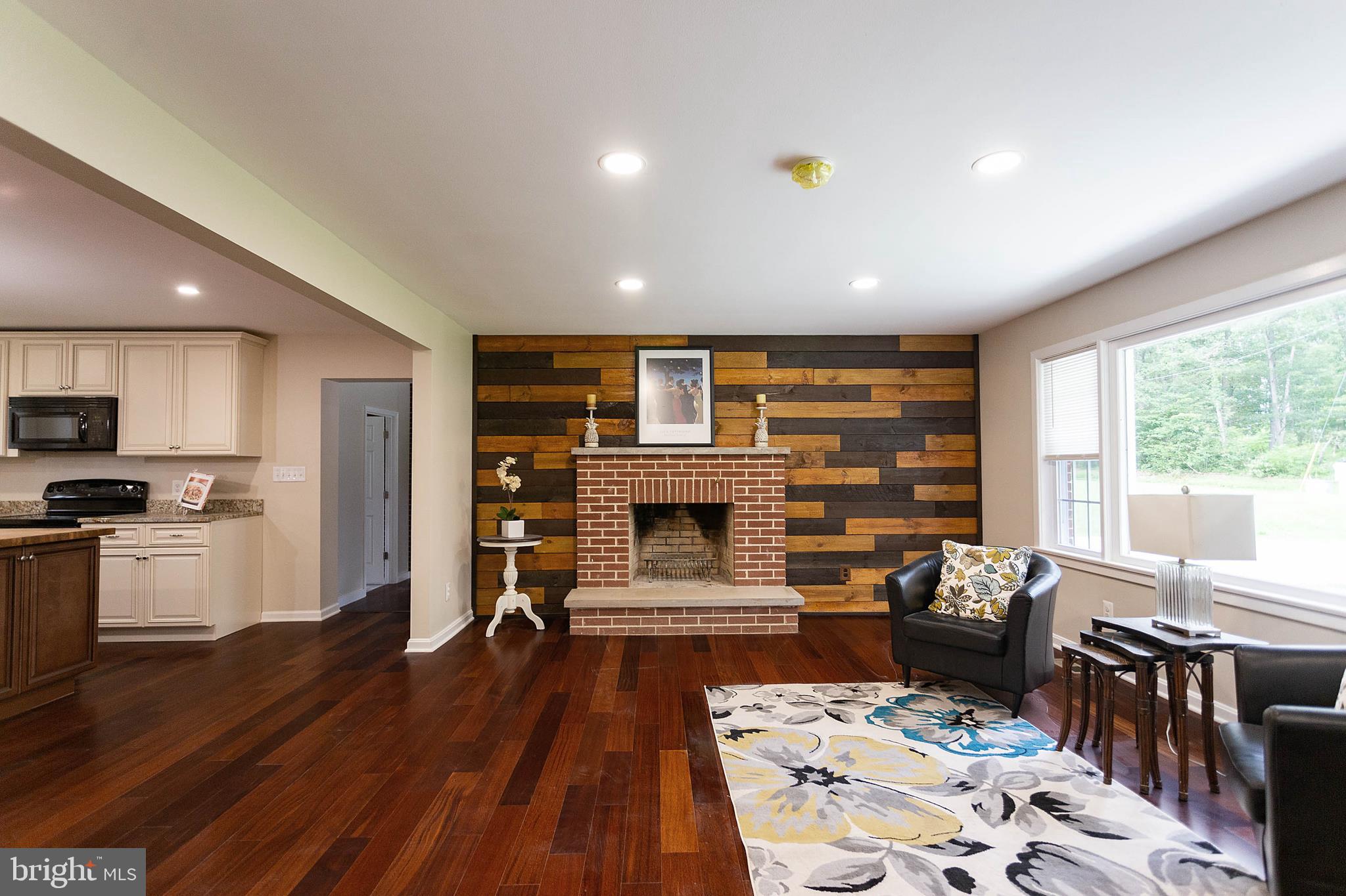 124 Dutrow Road Westminster, MD 21157 - Photo 7 of 38 Beautiful accent wall with wood burning fireplace