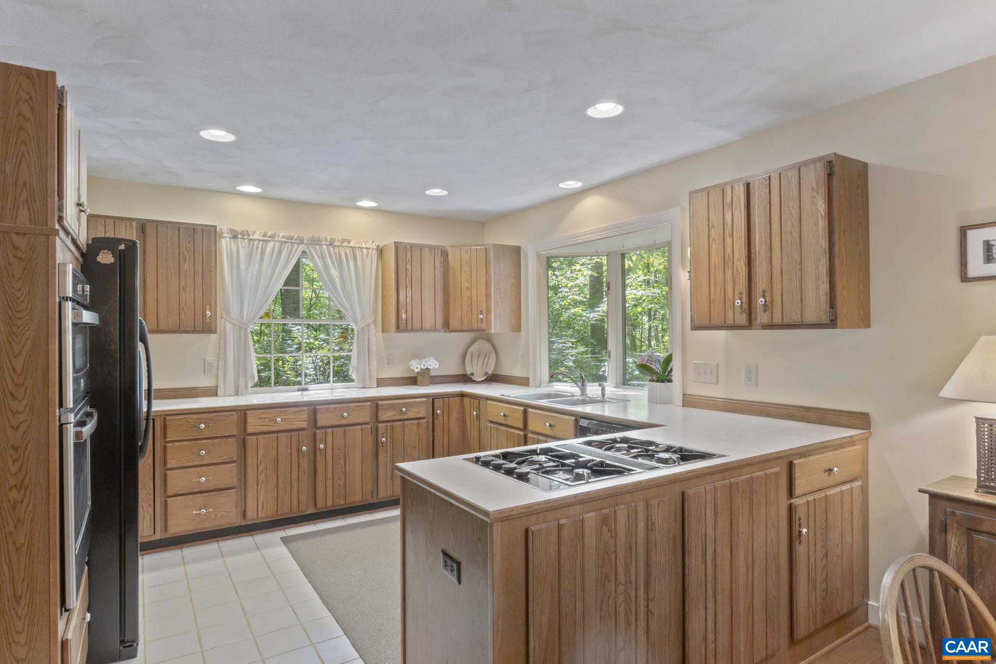 2 Whippoorwill Lane Palmyra, VA 22963 - Photo 8 of 36 a kitchen with a stove a sink a refrigerator and a window
