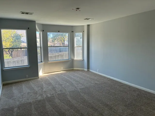 an empty room with windows