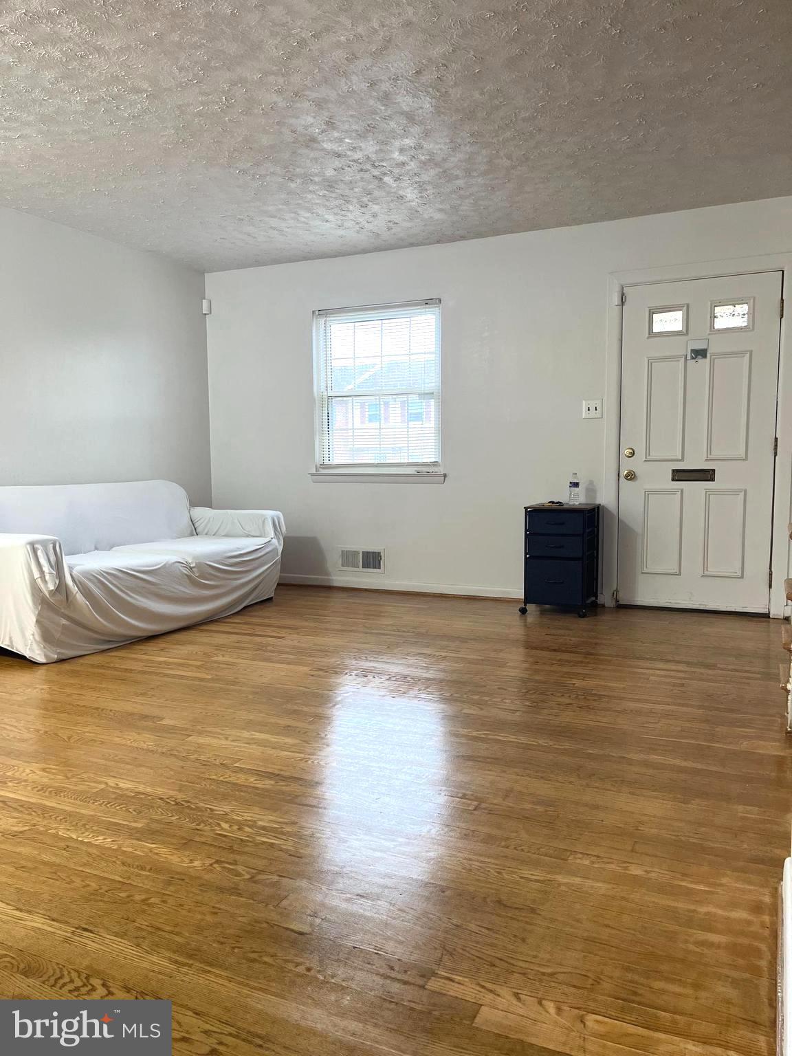 2943 Sunset Lane Suitland, MD 20746 - Photo 14 of 24 a view of a room with wooden floor