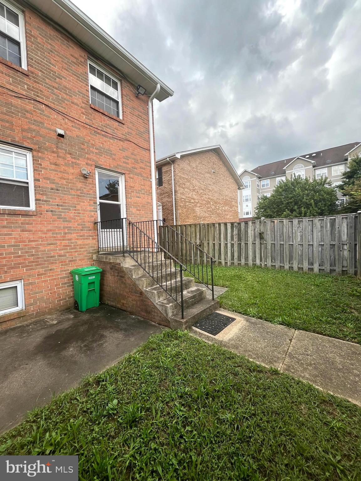 2943 Sunset Lane Suitland, MD 20746 - Photo 4 of 24 a view of a house with a small yard and a garden