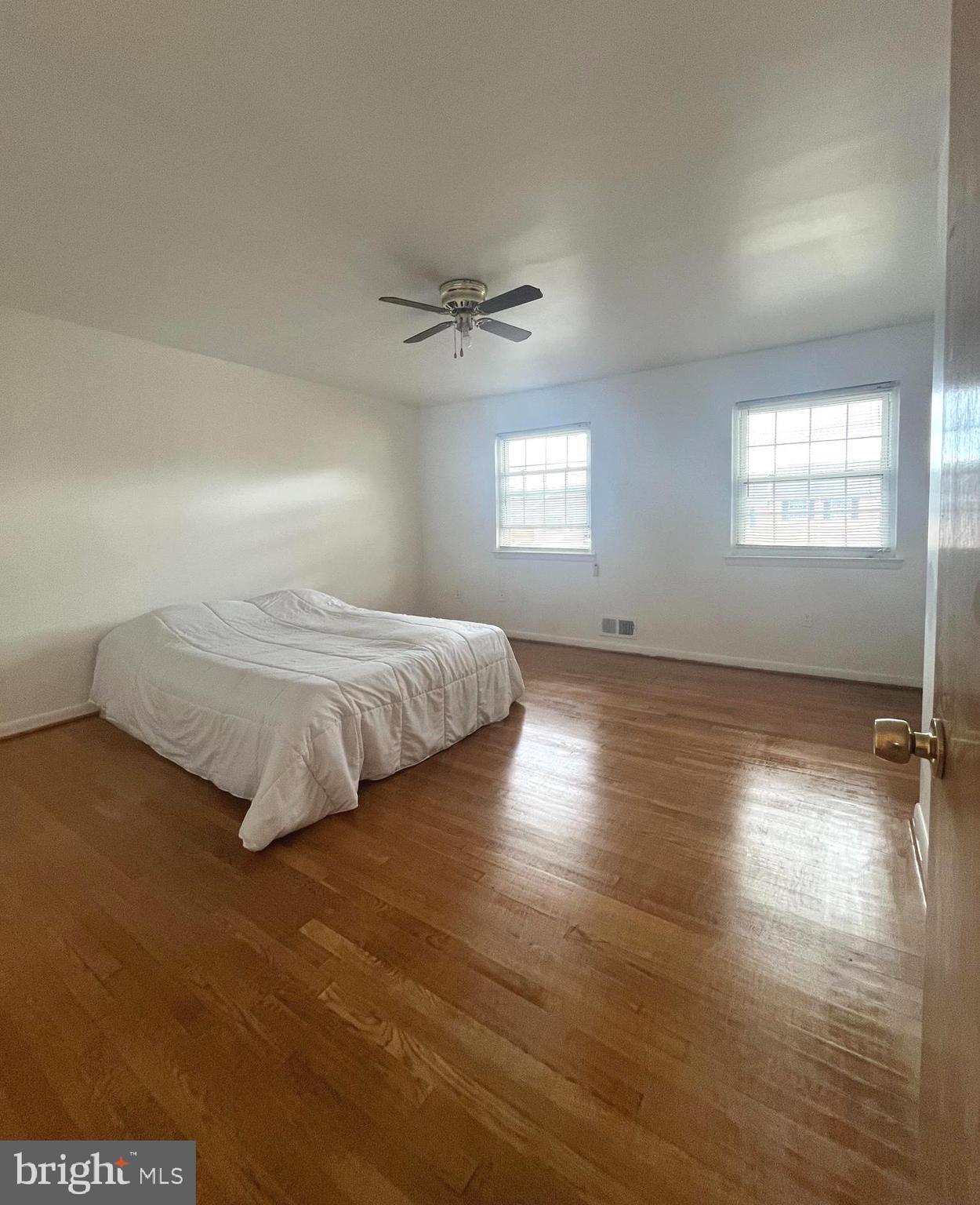 2943 Sunset Lane Suitland, MD 20746 - Photo 7 of 24 a bedroom with a bed and window