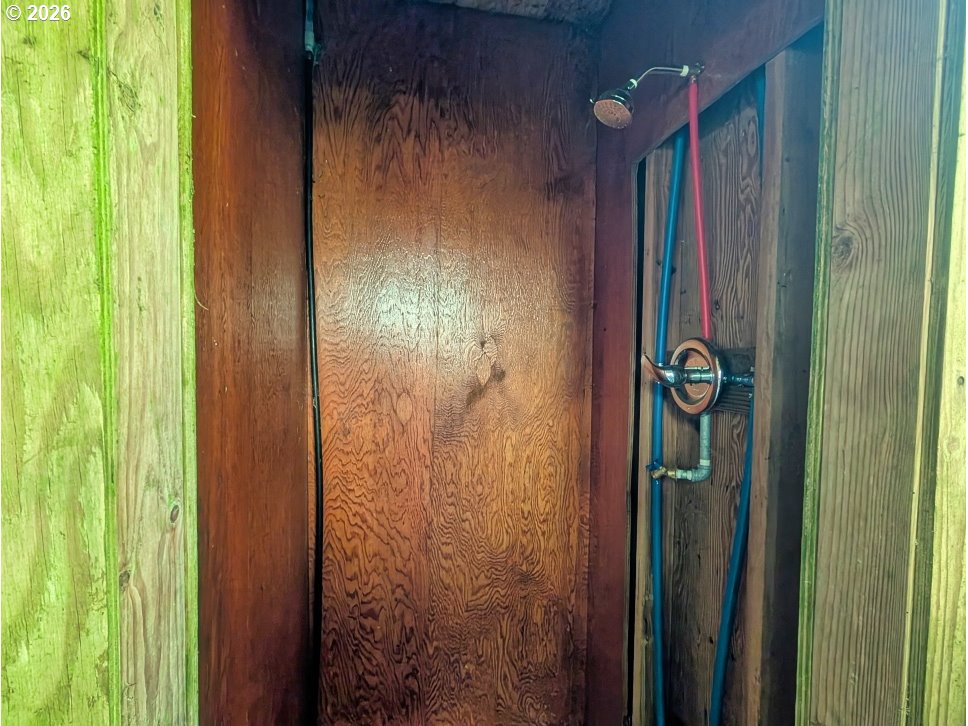 30460 Road 12 Rhododendron, OR 97049 - Photo 24 of 29 a bathroom with a shower curtain and a window