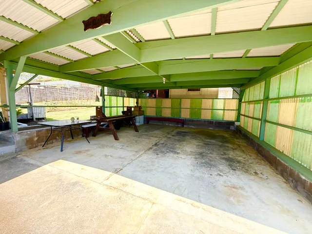 a view of a backyard with a patio