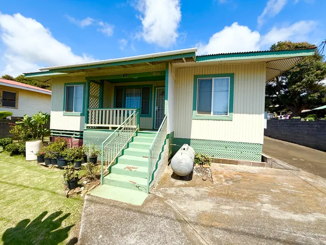 a front view of a house with a porch