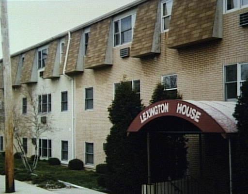 a front view of a building with glass windows