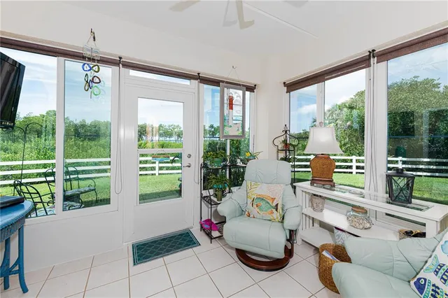 a living room with furniture and garden view