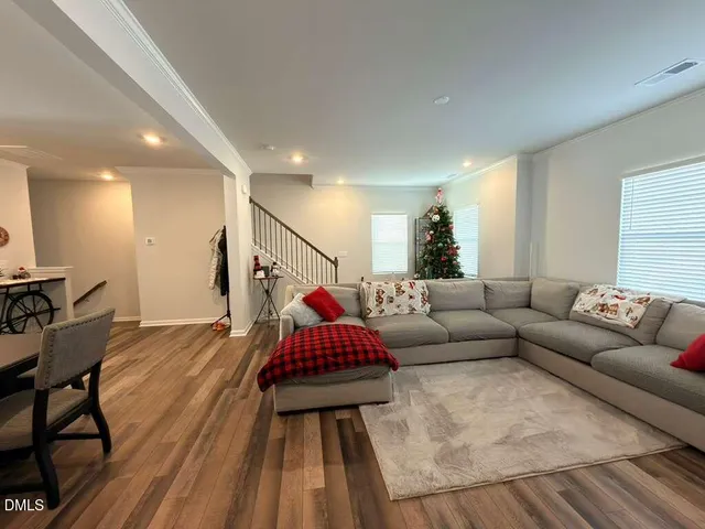 a living room with furniture and a rug