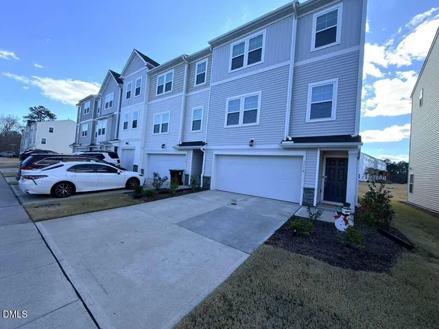 a view of a car park in front of a building