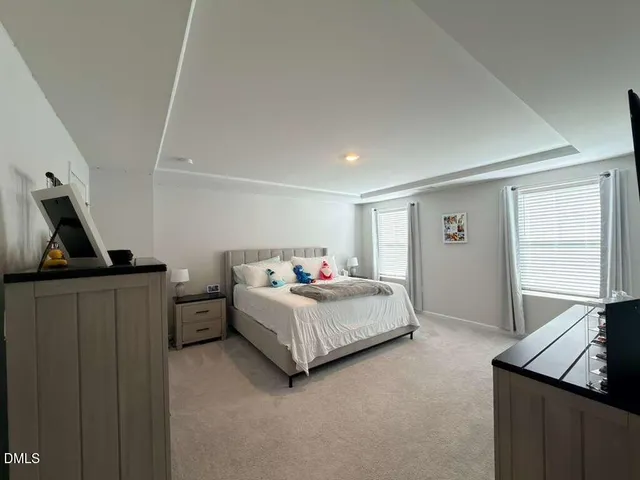 a bedroom with a bed and furniture