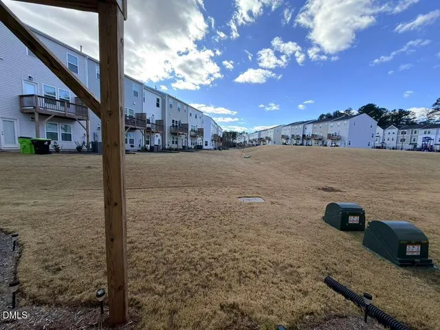 a view of a street with a building in the background