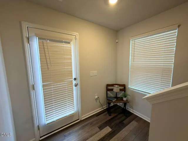 a view of workspace with wooden floor