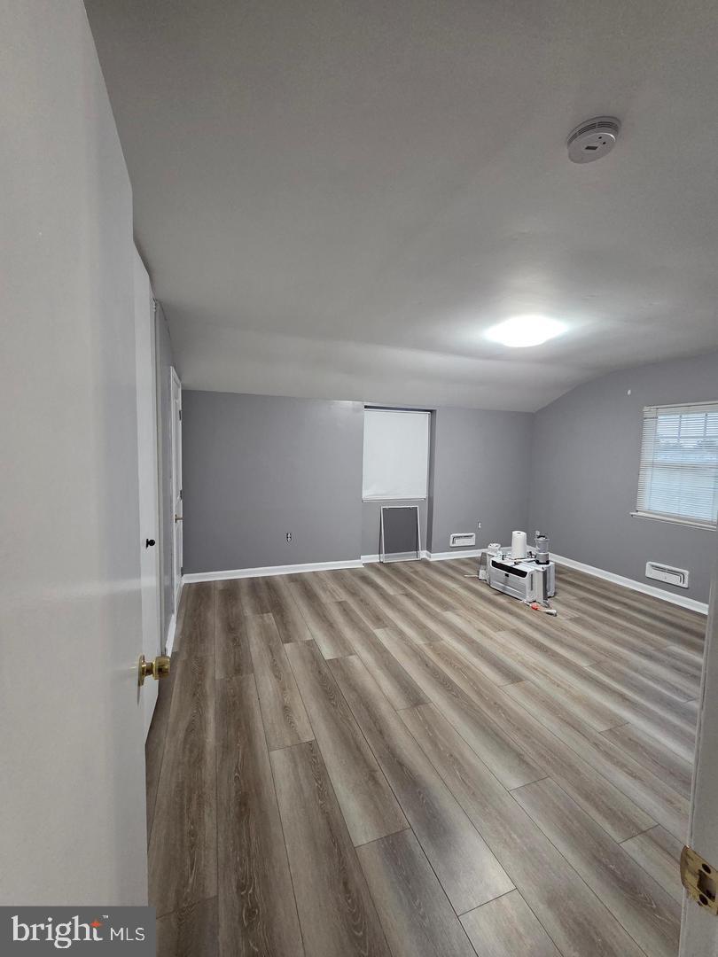 1407 Adamsview Road Baltimore, MD 21228 - Photo 30 of 40 a bedroom with a bed and a mirror