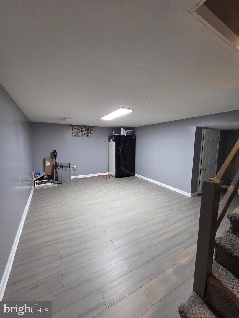 1407 Adamsview Road Baltimore, MD 21228 - Photo 34 of 40 a view of empty room with wooden floor