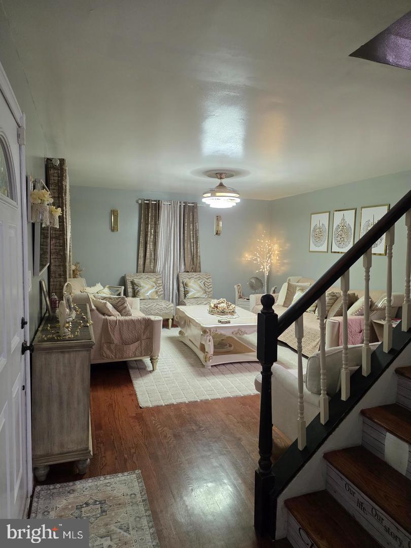 1407 Adamsview Road Baltimore, MD 21228 - Photo 6 of 40 a living room with furniture and a chandelier