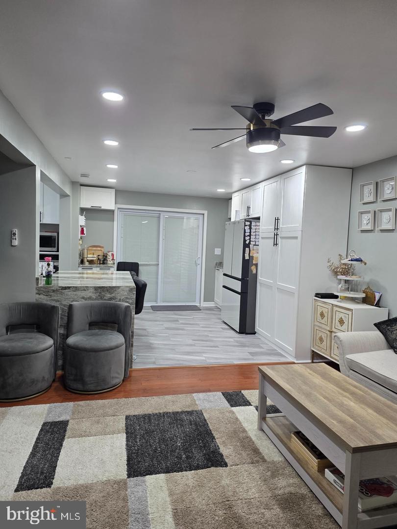 1407 Adamsview Road Baltimore, MD 21228 - Photo 8 of 40 a room with furniture and a wooden floor