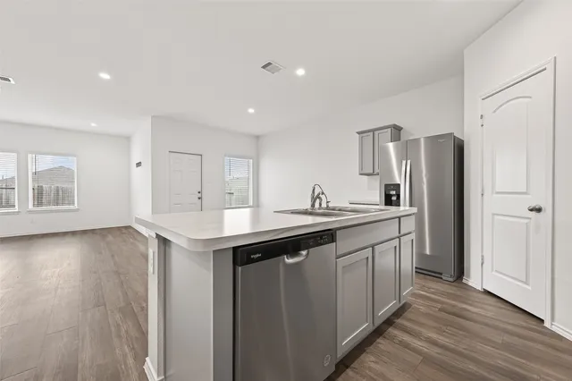 a bathroom with a shower and a glass door