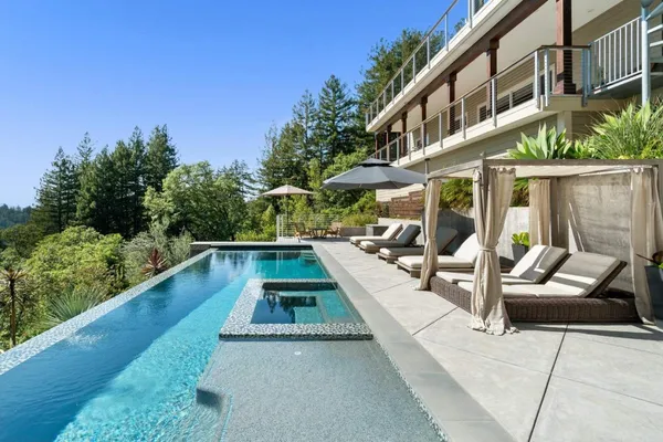 swimming pool view with a seating space