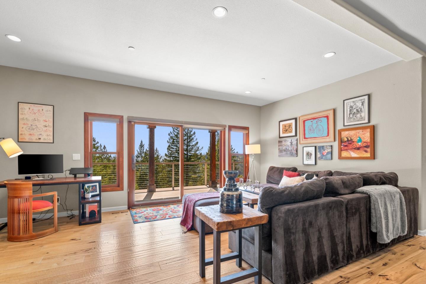 24101 Mountain Charlie Road Los Gatos, CA 95033 - Photo 30 of 59 a living room with furniture a flat screen tv and a floor to ceiling window