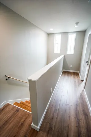 a view of a room with wooden floor