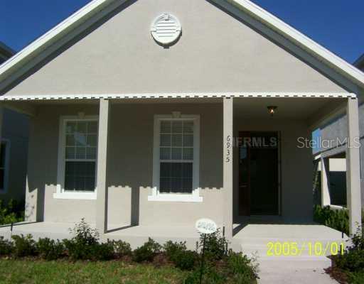 6935 Beargrass Road Harmony, FL 34773 - Photo 1 of 1 a front view of a house with a yard