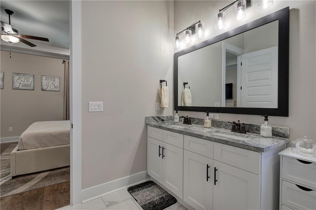 503 London Road Ball Ground, GA 30107 - Photo 24 of 55 a bathroom with a double vanity sink and mirror