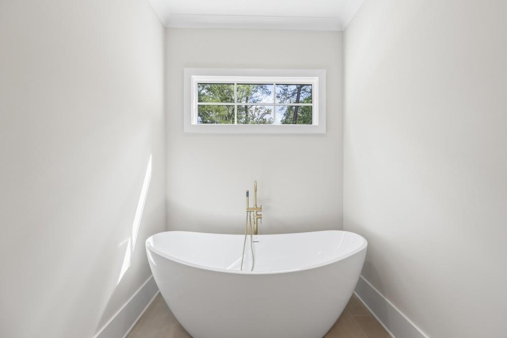 1301 Grayson Pointe Drive Buckhead, GA 30625 - Photo 26 of 56 a white bath tub sitting in a bathroom
