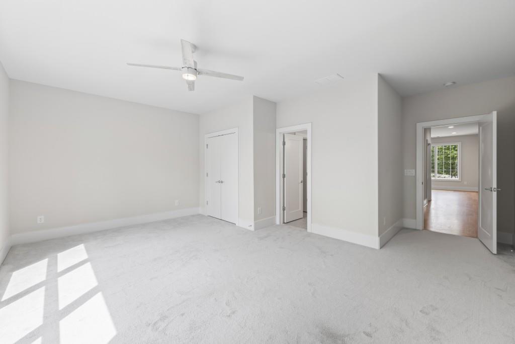1301 Grayson Pointe Drive Buckhead, GA 30625 - Photo 40 of 56 an empty room with windows and closet
