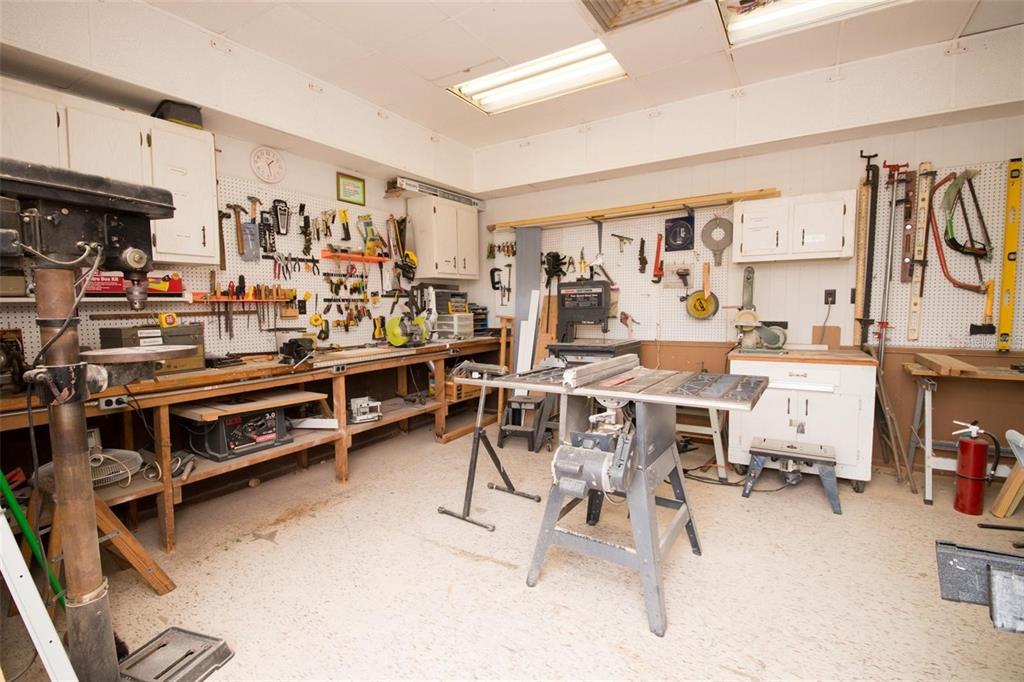 9527 Azure Cove Bradenton, FL 34210 - Photo 45 of 49 a view of a room with lots of furniture and white cabinets