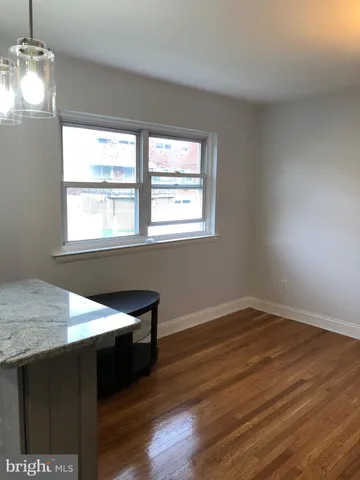 a kitchen with granite countertop cabinets stainless steel appliances and a sink