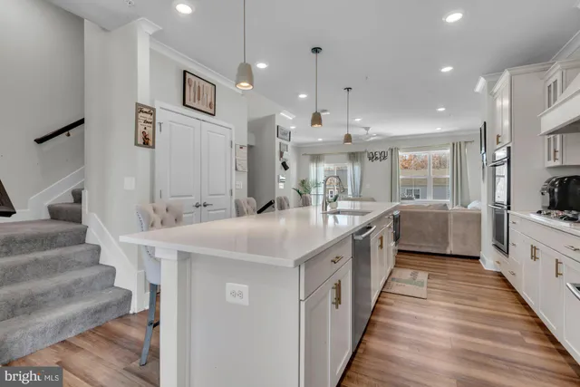 a kitchen with a stove and white cabinets