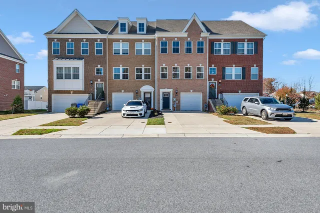 a view of multiple houses with yard