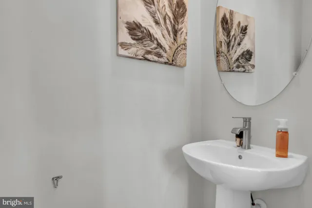 a bathroom with a sink a toilet and bathtub