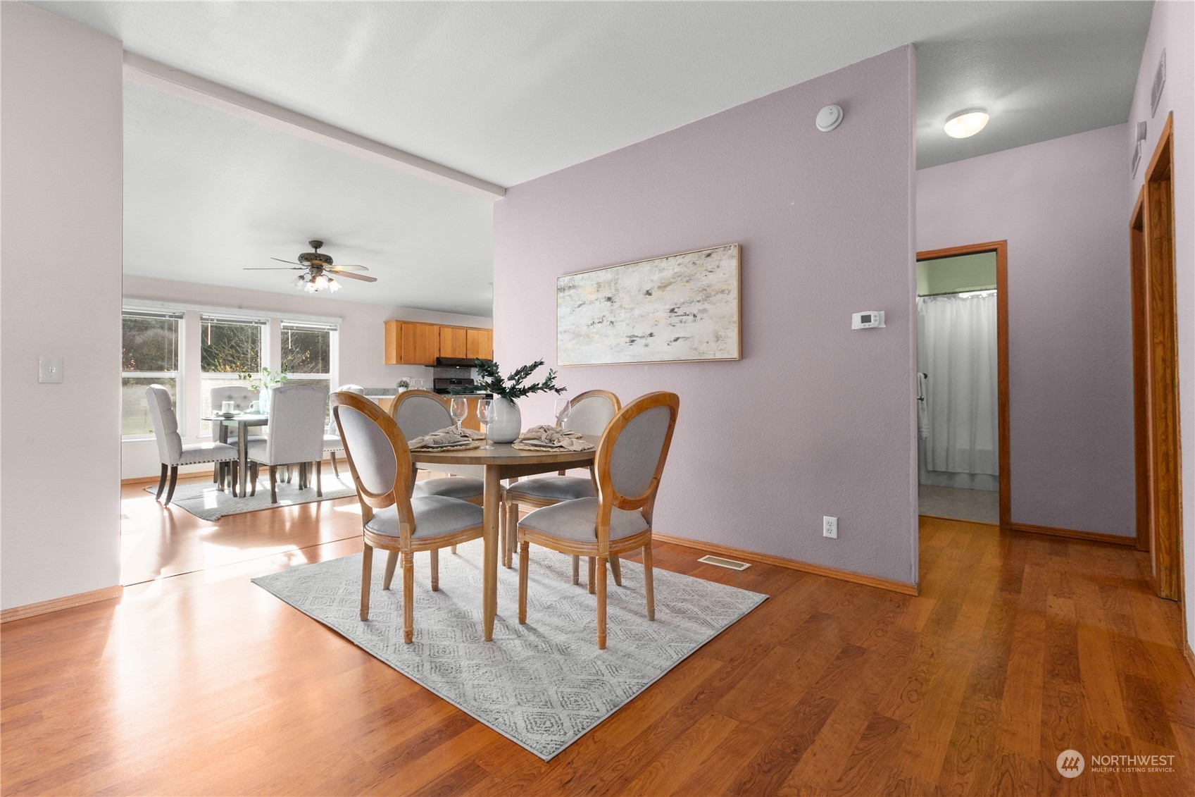 3002 Creasey Road Custer, WA 98240 - Photo 12 of 40 a view of a dining room with furniture and wooden floor