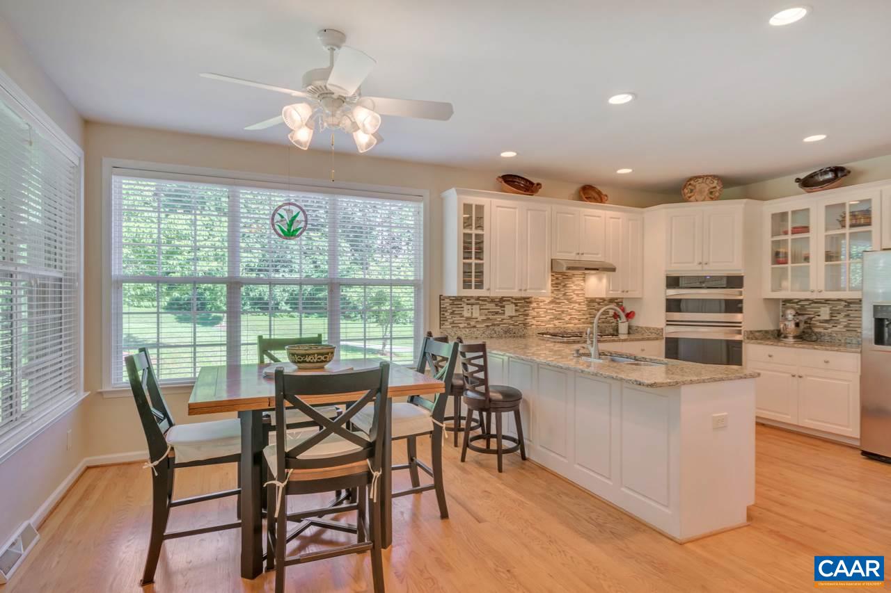 1915 Ridgetop Drive Charlottesville, VA 22903 - Photo 11 of 35 a view of a dining room with furniture window and wooden floor